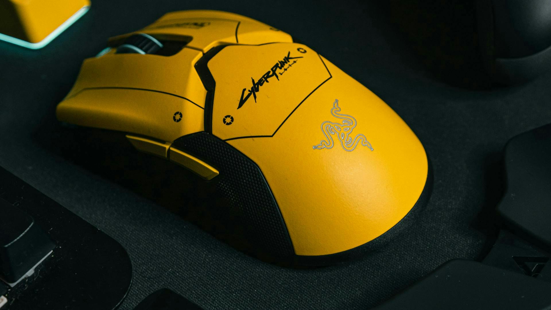 A gaming mouse with a Cyberpunk 2077 look, viewed from the side with two additional buttons. | Credit: Robert Torres / Unsplash.