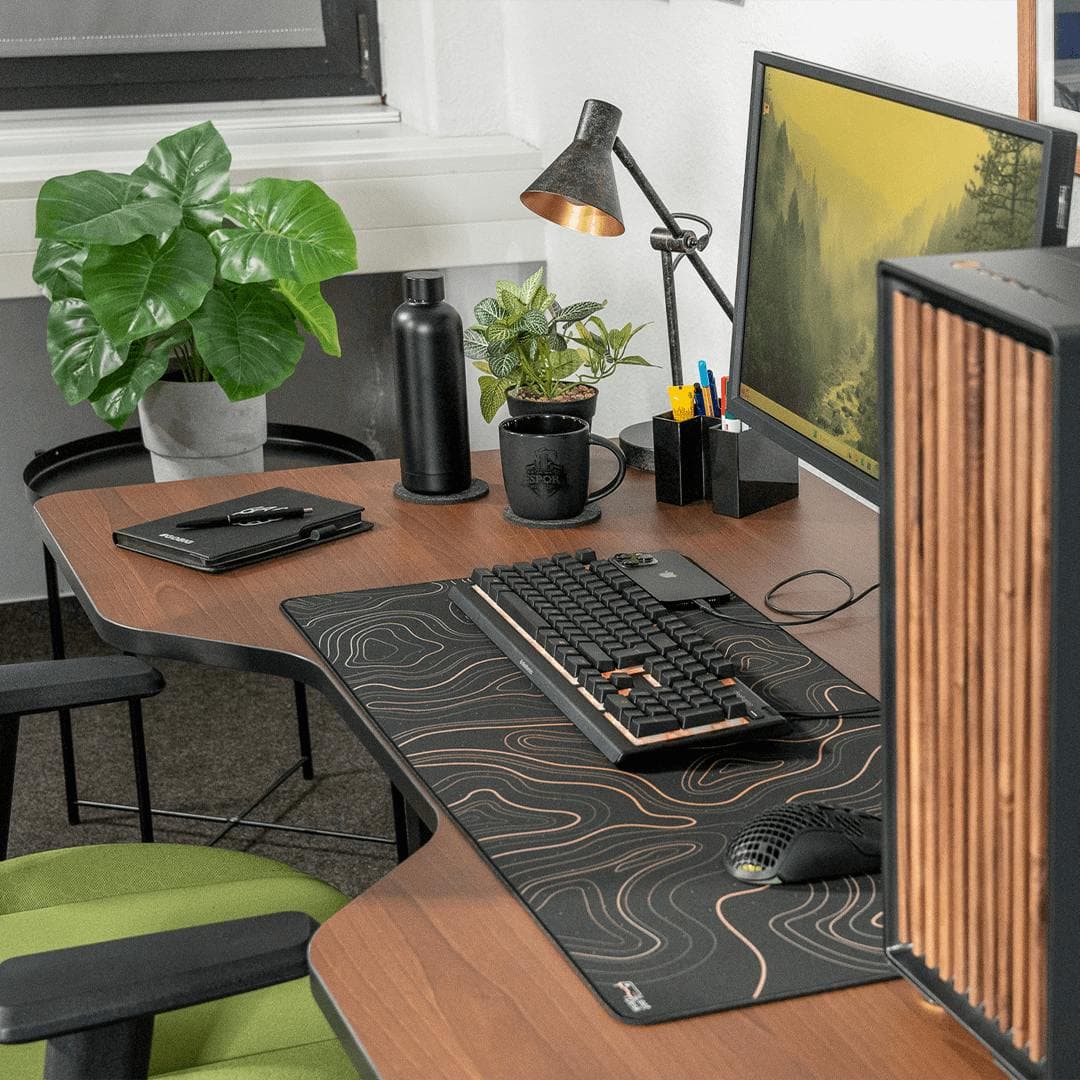 LeetDesk Pro Darkwood gaming desk in wood finish, height-adjustable with cockpit