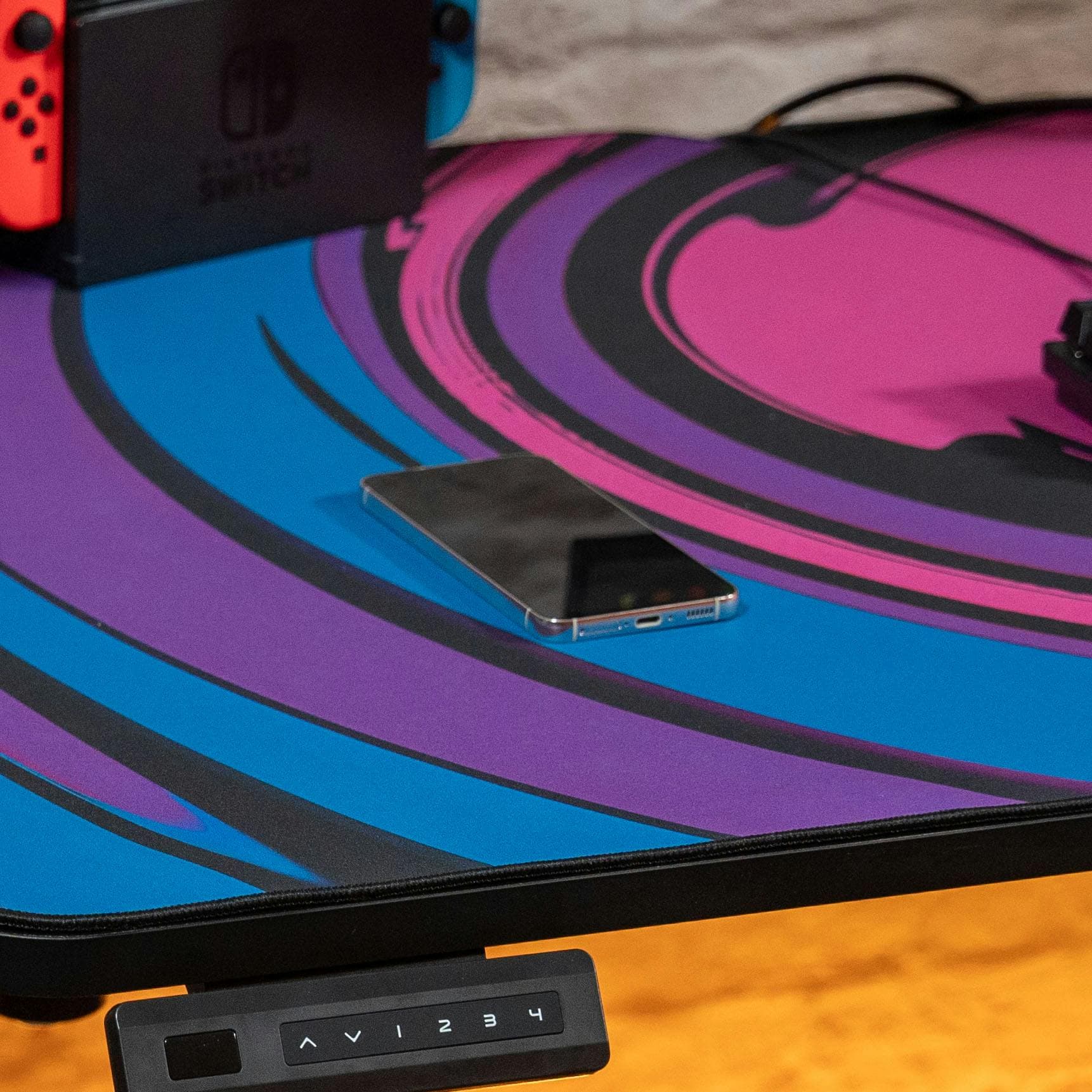 LeetDesk Wireless Charger Powers Phone Through Desk and Mouse Pad