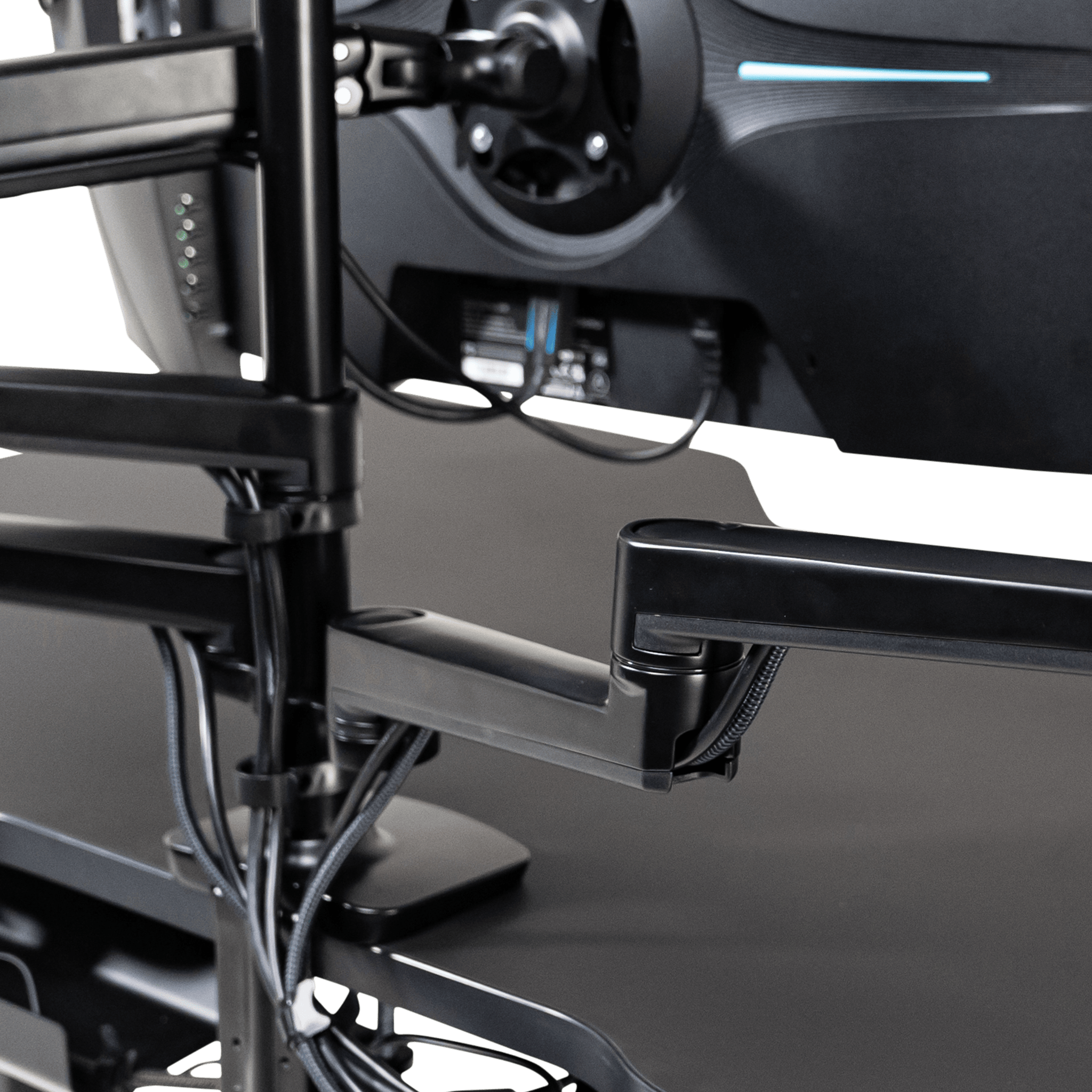 The LeetDesk triple monitor mount features double clamps and arm extensions